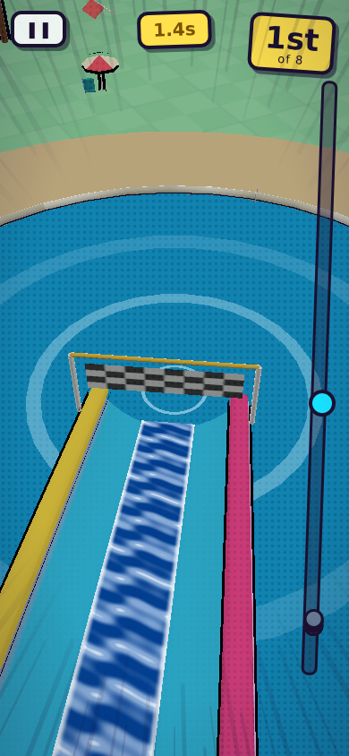 Looking down the last straight of a water slide towards a chequered finish banner and the round splash pool beyond it.